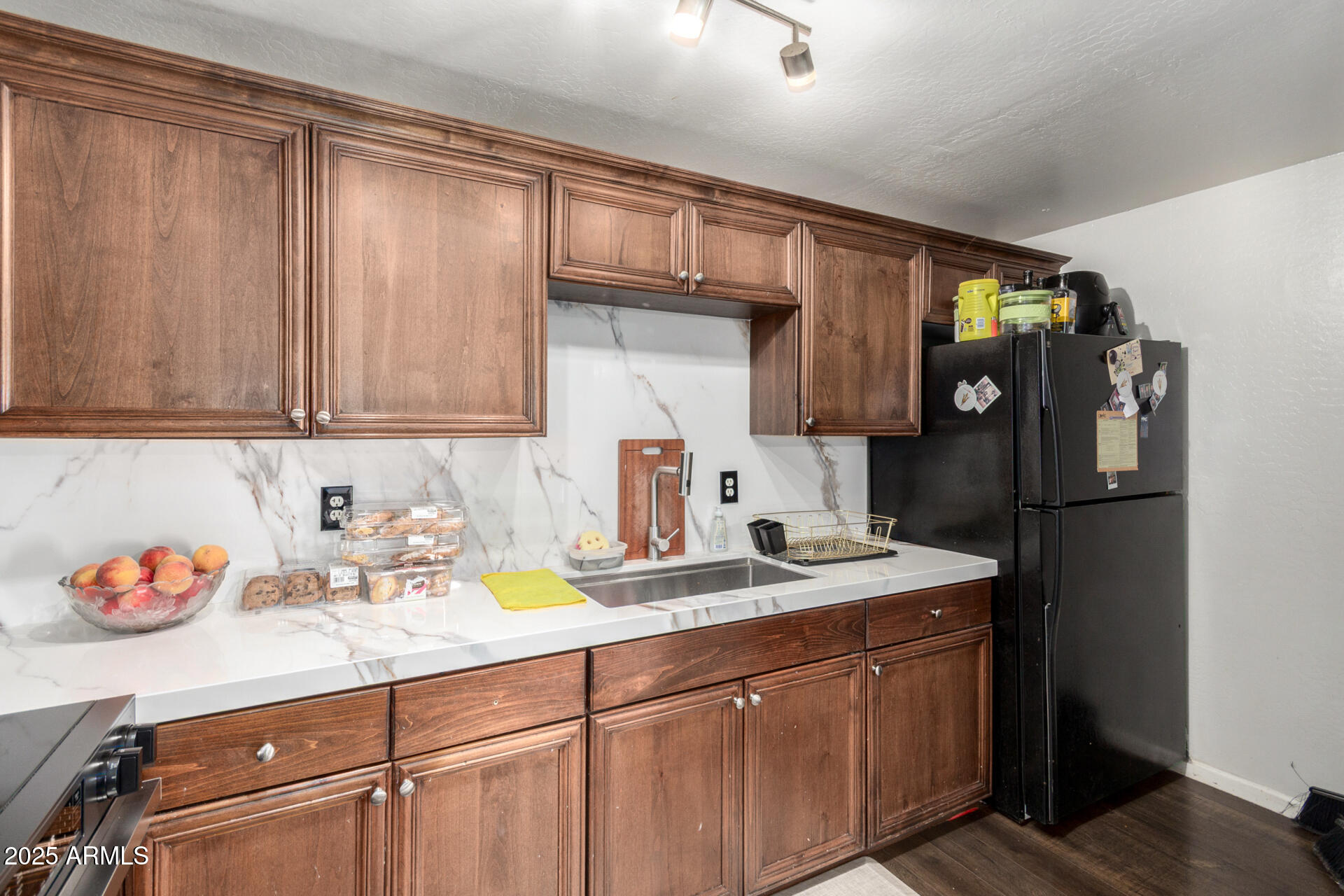6224 West Berkeley Road Phoenix, AZ 85035 - Photo 14 of 27 a kitchen with a sink cabinets and appliances