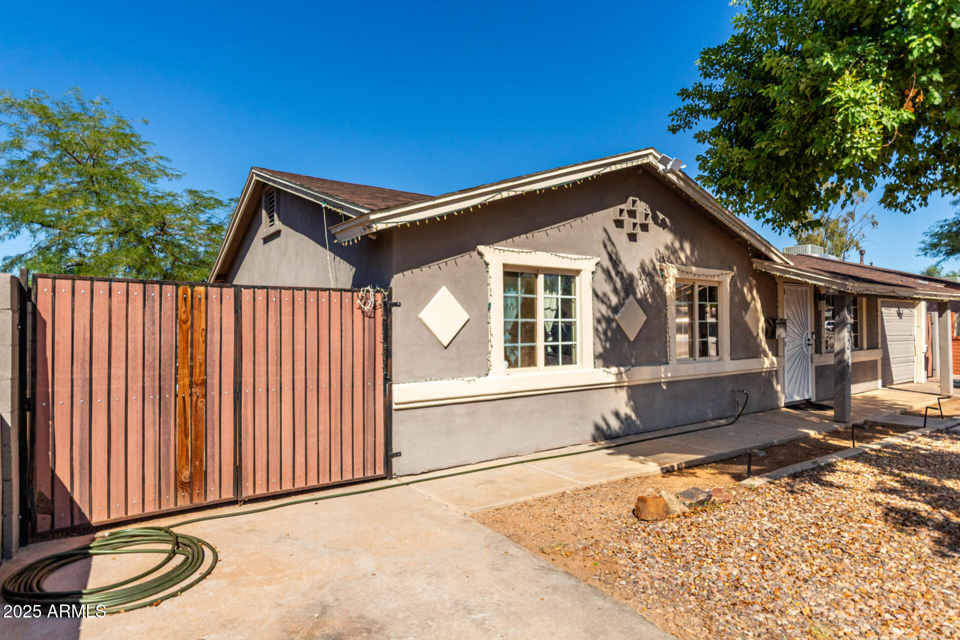6224 West Berkeley Road Phoenix, AZ 85035 - Photo 2 of 27 a front view of a house with a yard