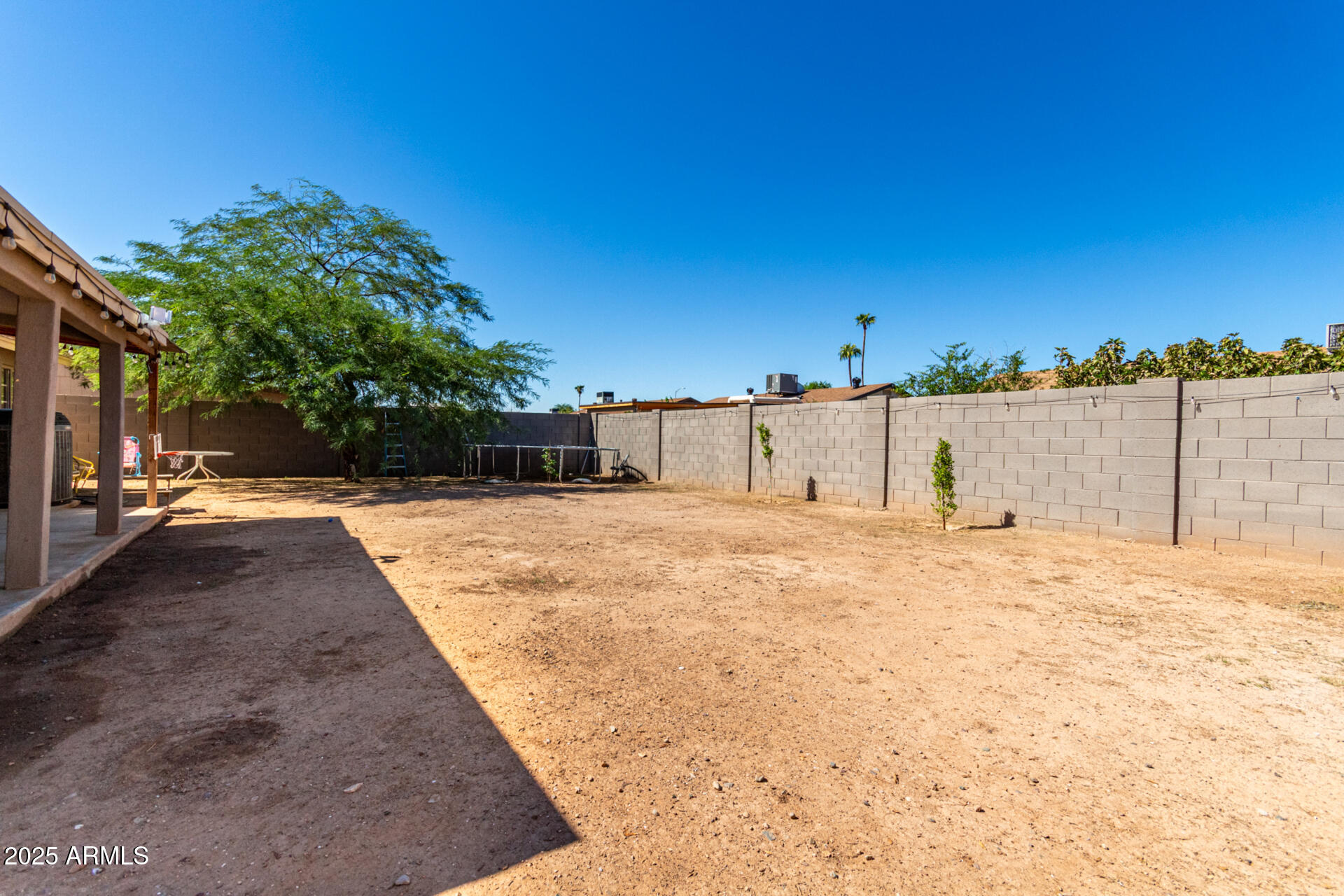 6224 West Berkeley Road Phoenix, AZ 85035 - Photo 24 of 27 a view of swimming pool with a yard