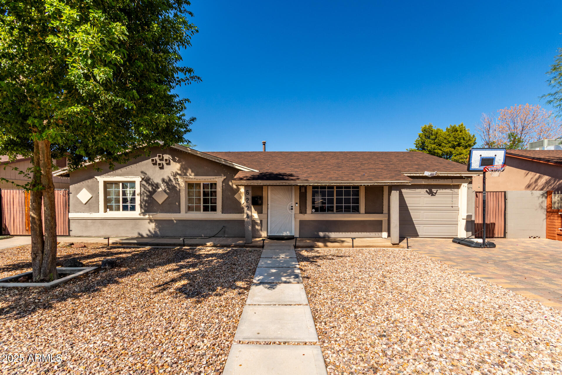 6224 West Berkeley Road Phoenix, AZ 85035 - Photo 3 of 27 a front view of a house with a yard