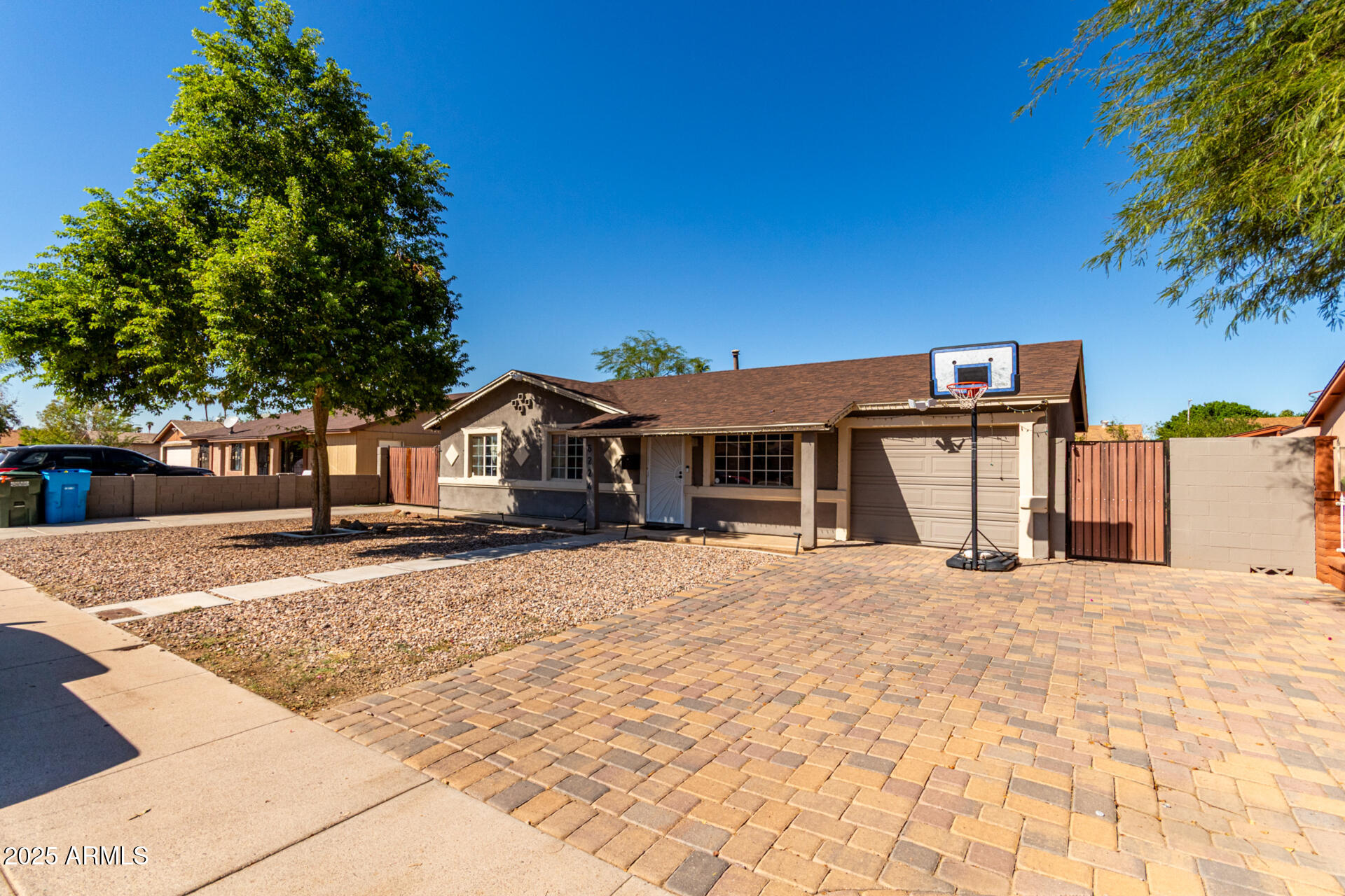 6224 West Berkeley Road Phoenix, AZ 85035 - Photo 5 of 27 a front view of a house with a yard