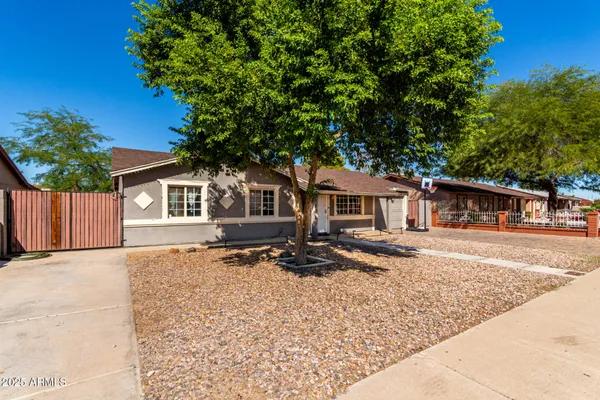 a house with trees in the background