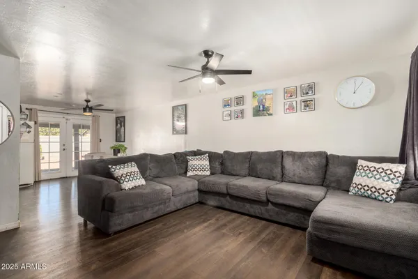 a living room with furniture and a large window