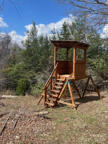 a backyard of a house with outdoor seating