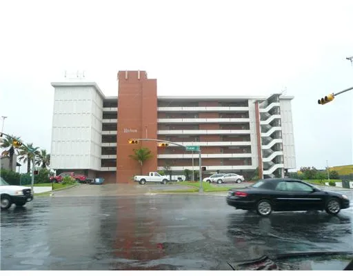 a view of building with parking area