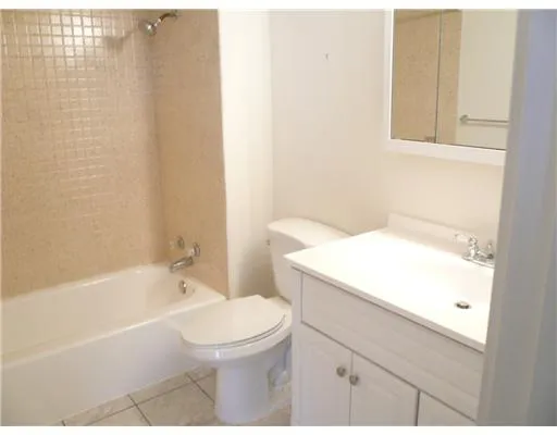 a kitchen with a stove and a refrigerator