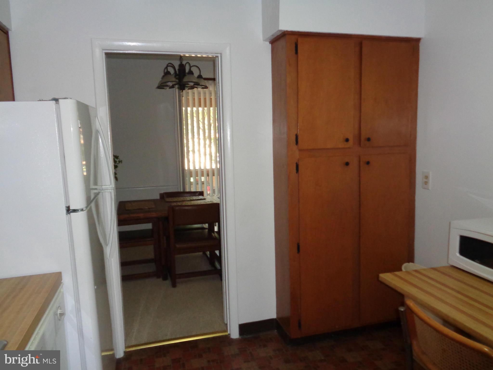 7 Cross Keys Road, Unit 7F Baltimore, MD 21210 - Photo 13 of 27 a view of room with furniture and wooden floor