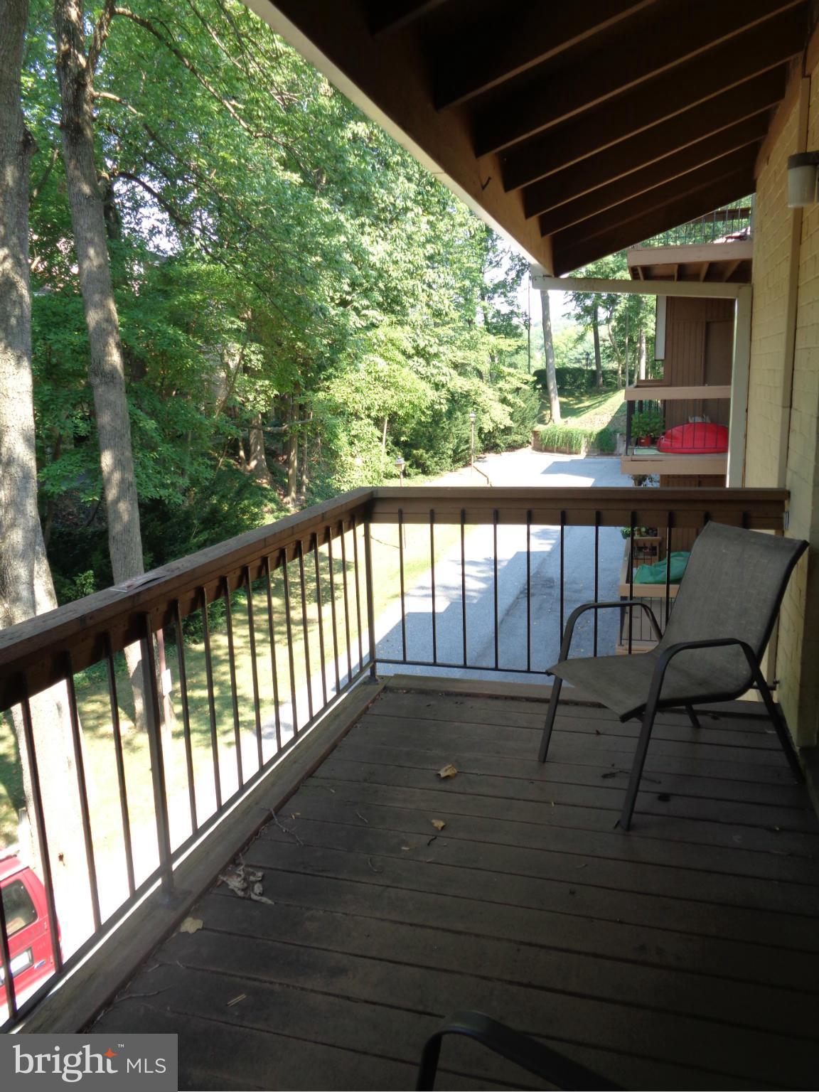 7 Cross Keys Road, Unit 7F Baltimore, MD 21210 - Photo 20 of 27 a view of balcony with wooden floor