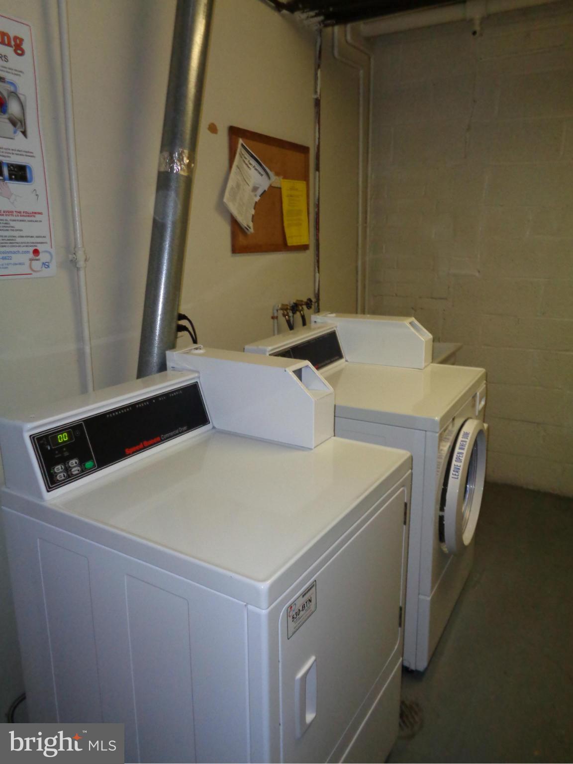 7 Cross Keys Road, Unit 7F Baltimore, MD 21210 - Photo 24 of 27 a utility room with dryer and washer