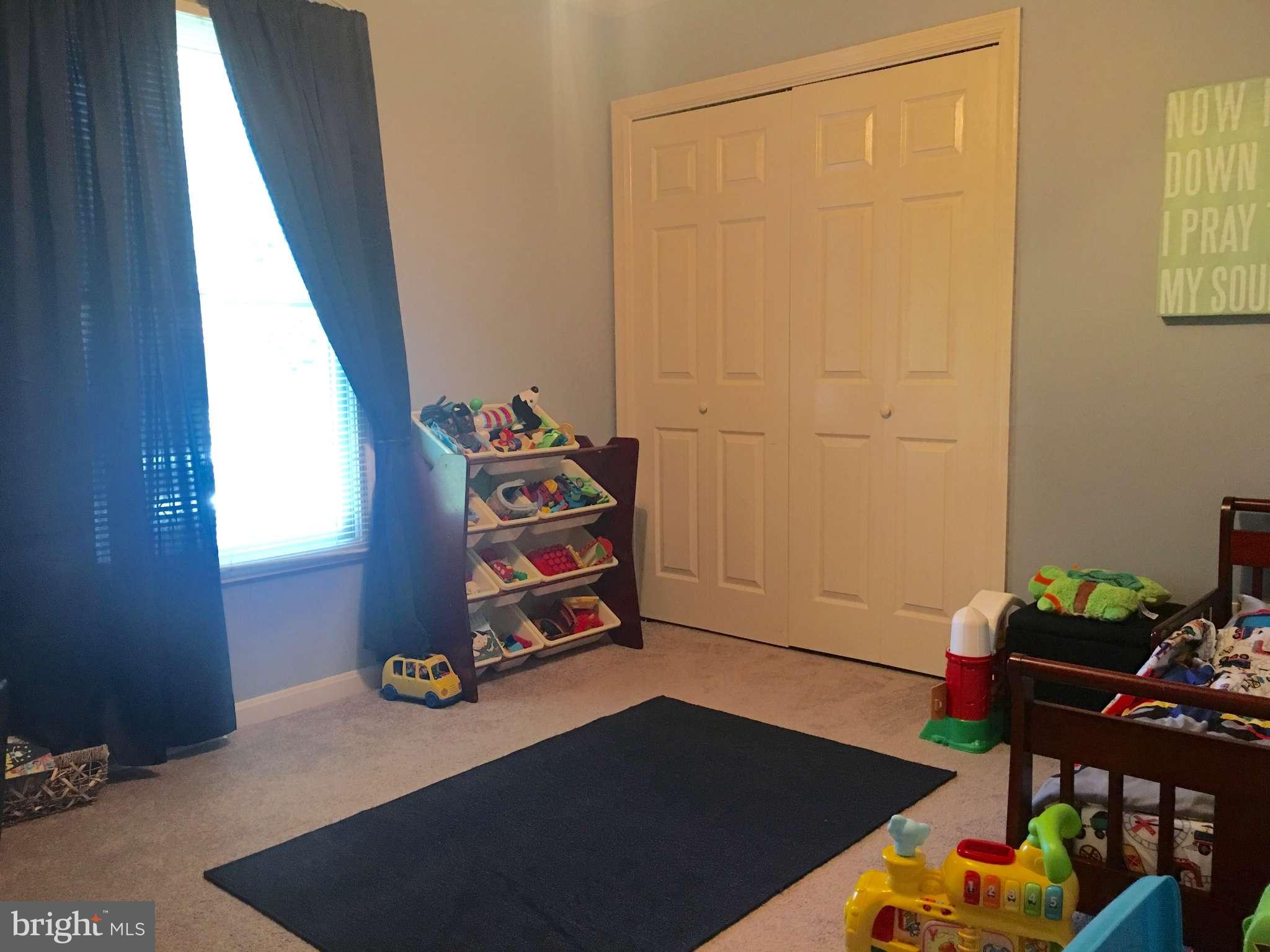 44099 Sandy Bottom Road Hollywood, MD 20636 - Photo 10 of 30 a bedroom with a bed and a window
