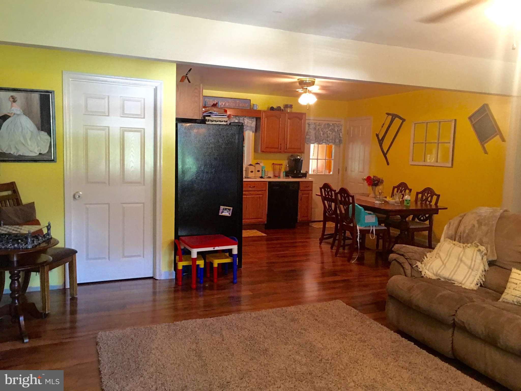 44099 Sandy Bottom Road Hollywood, MD 20636 - Photo 30 of 30 a living room with furniture and wooden floor