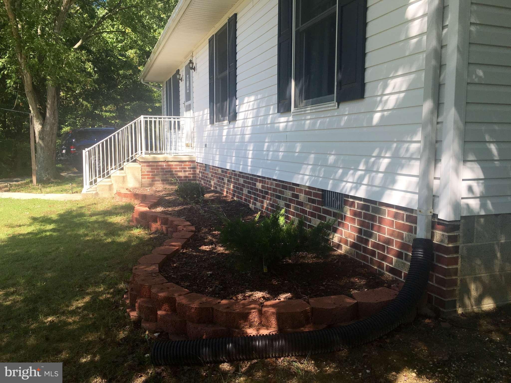 44099 Sandy Bottom Road Hollywood, MD 20636 - Photo 22 of 30 a view of backyard with pathway