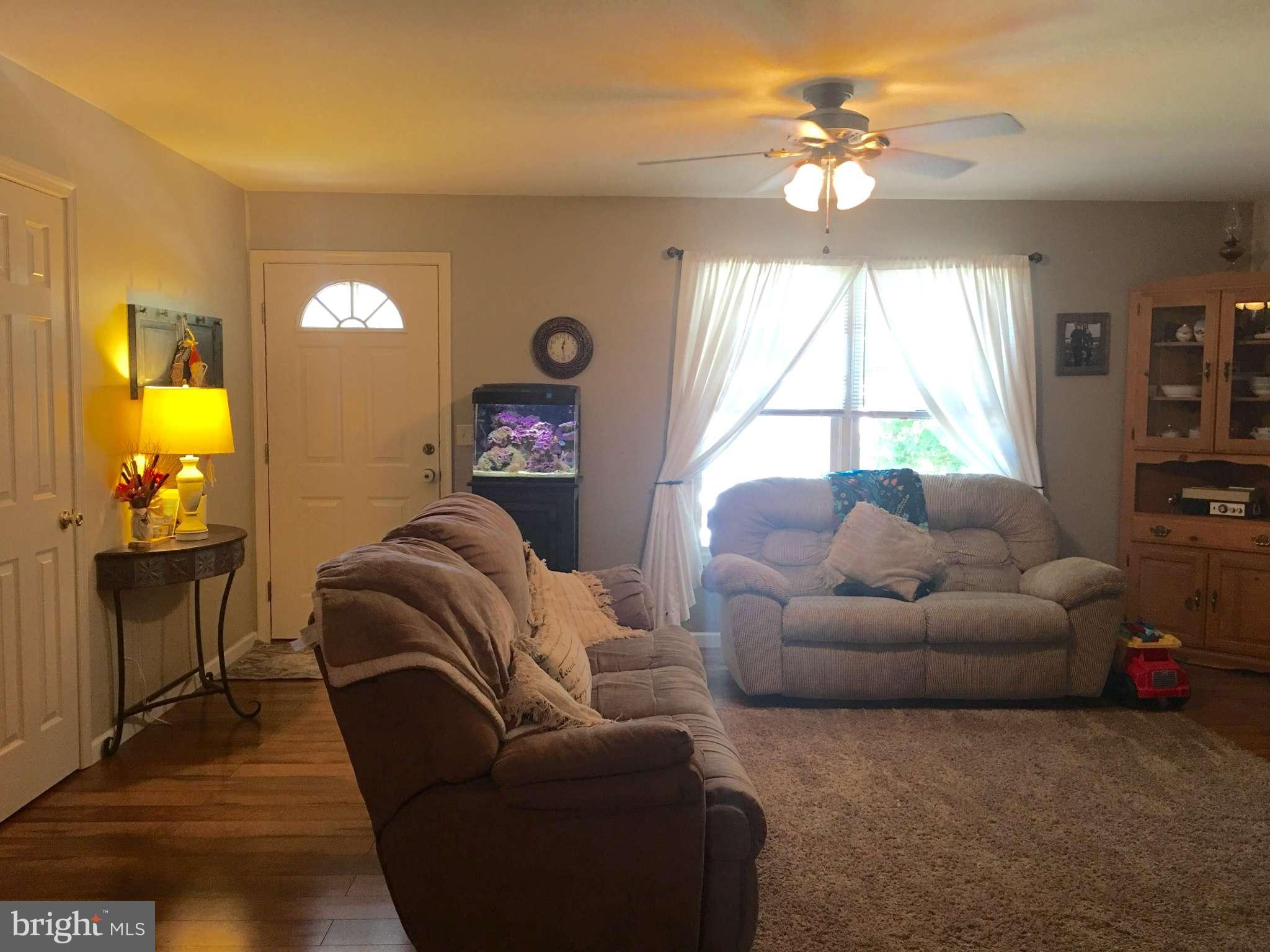 44099 Sandy Bottom Road Hollywood, MD 20636 - Photo 8 of 30 a living room with furniture and a large window