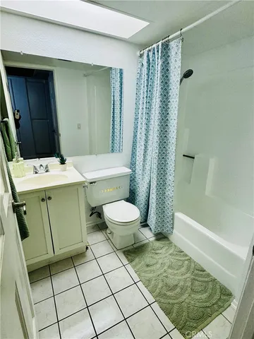 a bathroom with a toilet and shower