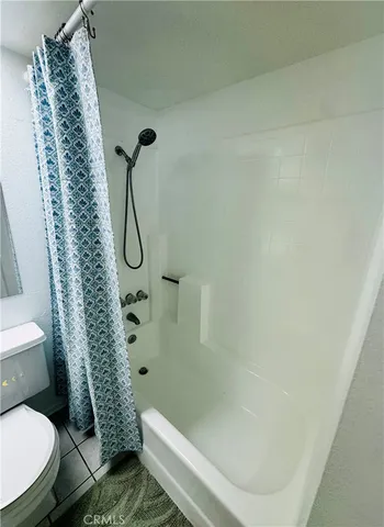 swimming pool view with a seating space