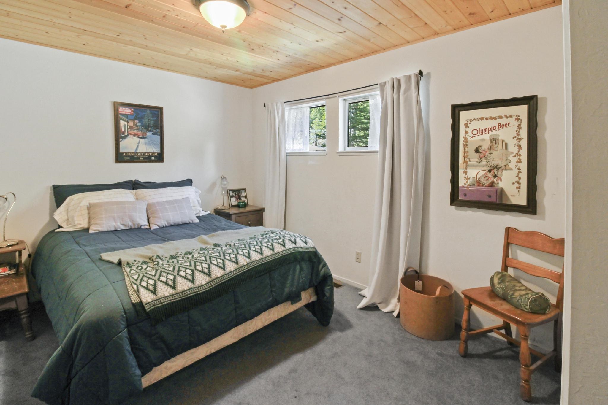 1503 Alpine Meadows Road Alpine Meadows, CA 96146 - Photo 12 of 28 a bedroom with a bed and wooden floor