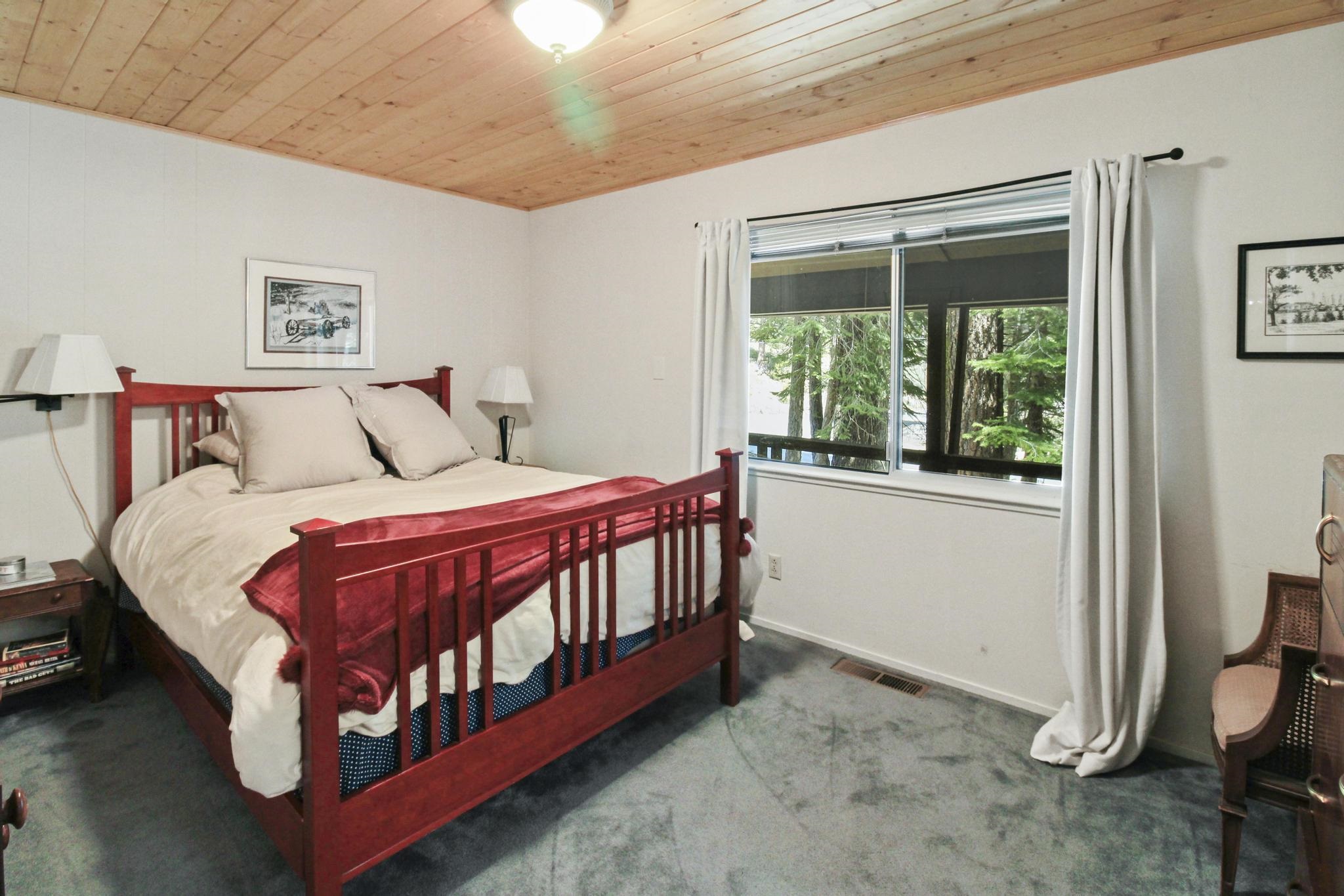 1503 Alpine Meadows Road Alpine Meadows, CA 96146 - Photo 10 of 28 a bed sitting in a bedroom next to a window