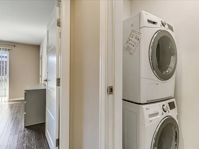 a view of a hallway with washer and dryer