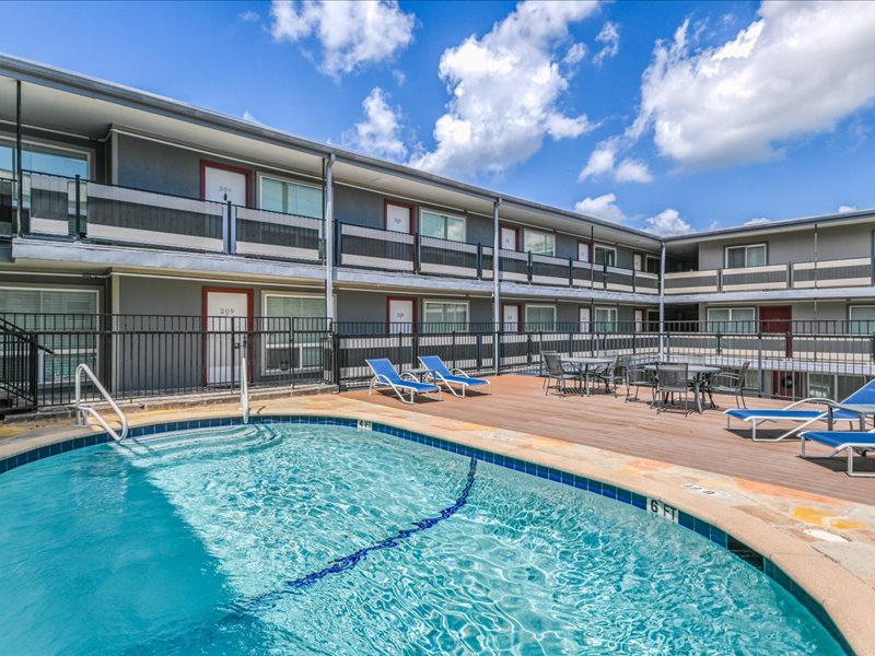 3110 Red River Street, Unit D212 Austin, TX 78705 - Photo 14 of 20 a view of a swimming pool with an outdoor seating