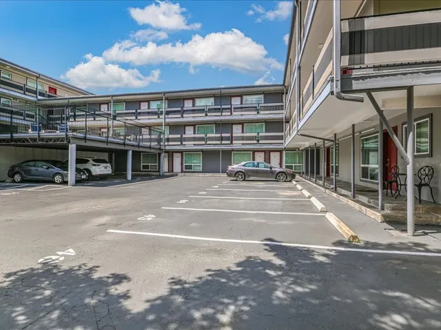 a view of a building with a street