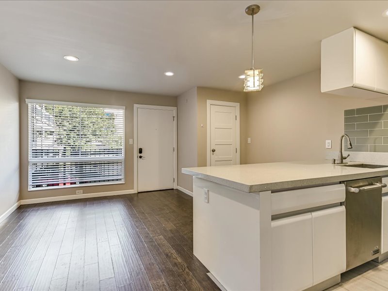 3110 Red River Street, Unit D212 Austin, TX 78705 - Photo 8 of 20 a view of a kitchen with a sink and wooden floor