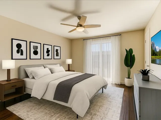 a bedroom with a large bed and a window