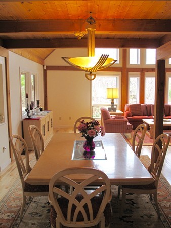 195 Kennedy Road Northampton, MA 01053 - Photo 13 of 22 a view of a dining room with furniture a chandelier and a large window