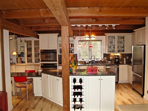195 Kennedy Road Northampton, MA 01053 - Photo 4 of 22 a kitchen with stainless steel appliances a refrigerator and a stove top oven