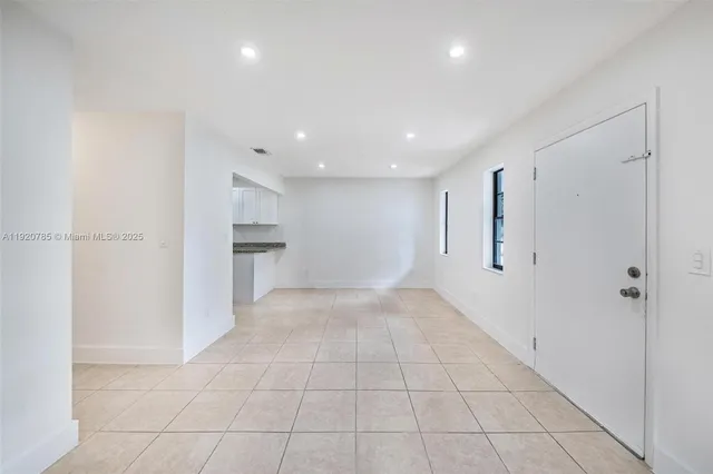 a view of a kitchen with a sink and dishwasher cabinets