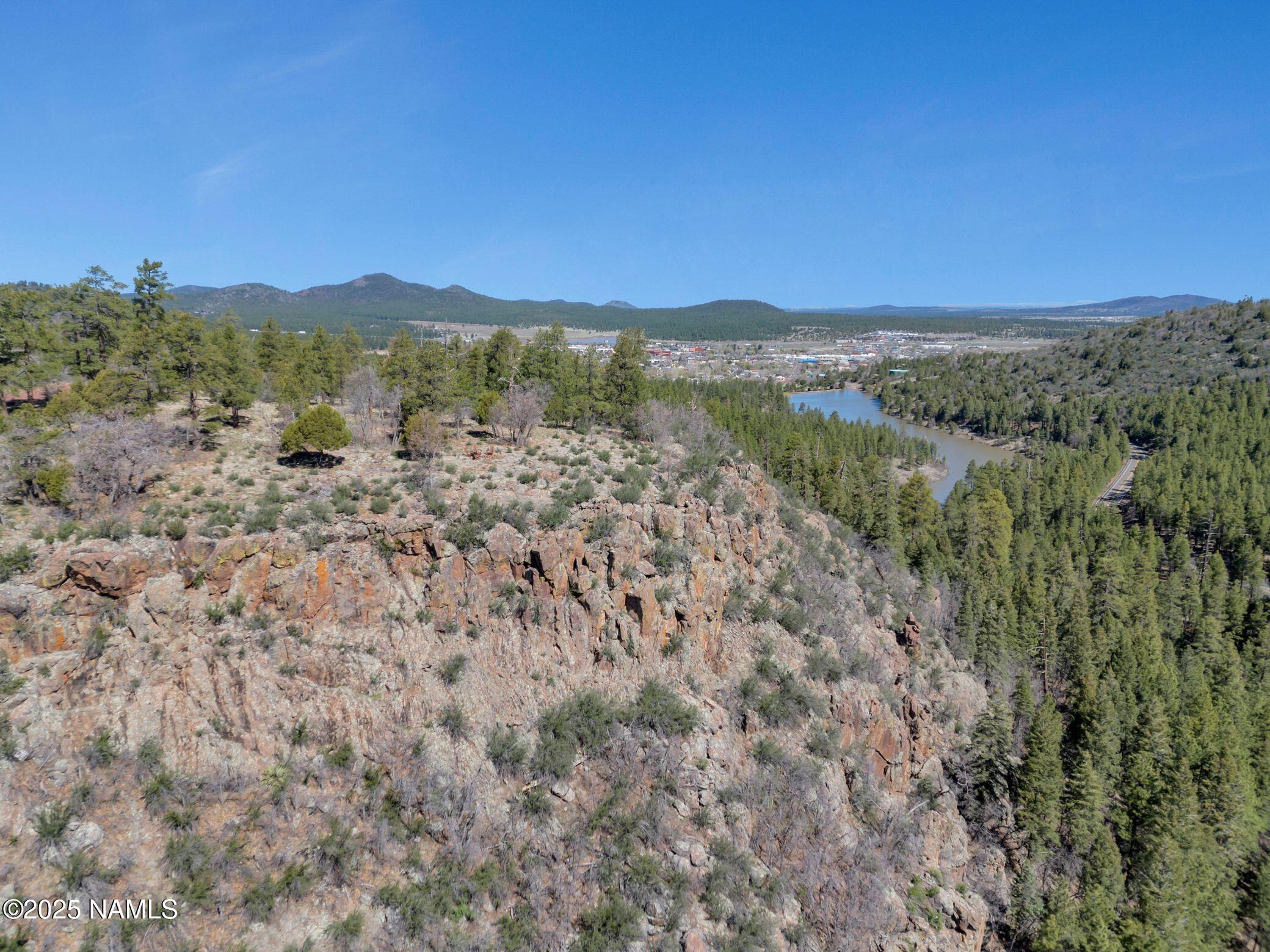 1642 Canyon View Loop Williams, AZ 86046 - Photo 17 of 41 a view of a forest with mountains in the background