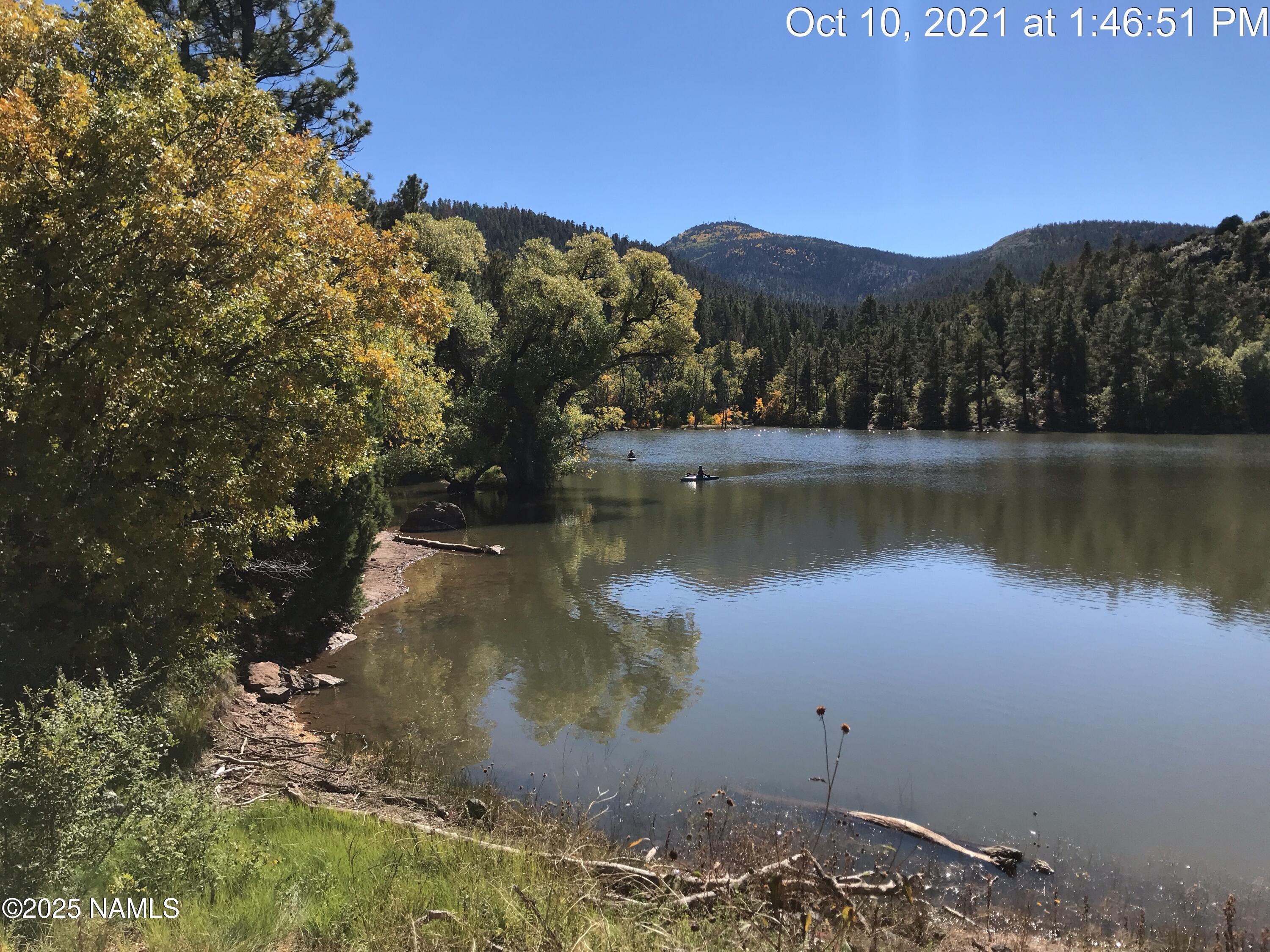 1642 Canyon View Loop Williams, AZ 86046 - Photo 23 of 41 a view of a lake in middle of a forest