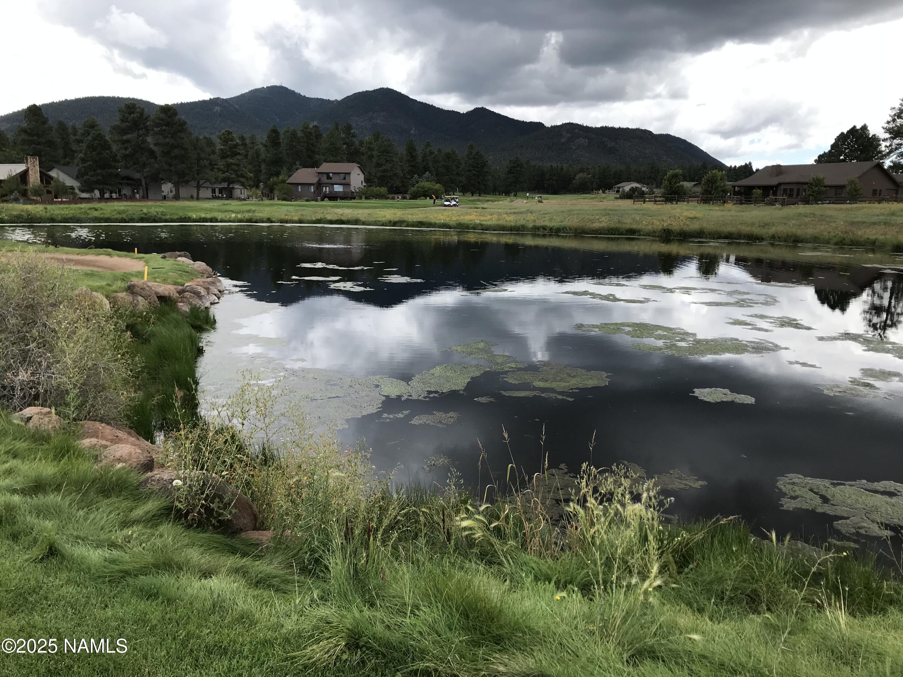 1642 Canyon View Loop Williams, AZ 86046 - Photo 24 of 41 a view of a lake with a mountain in the background