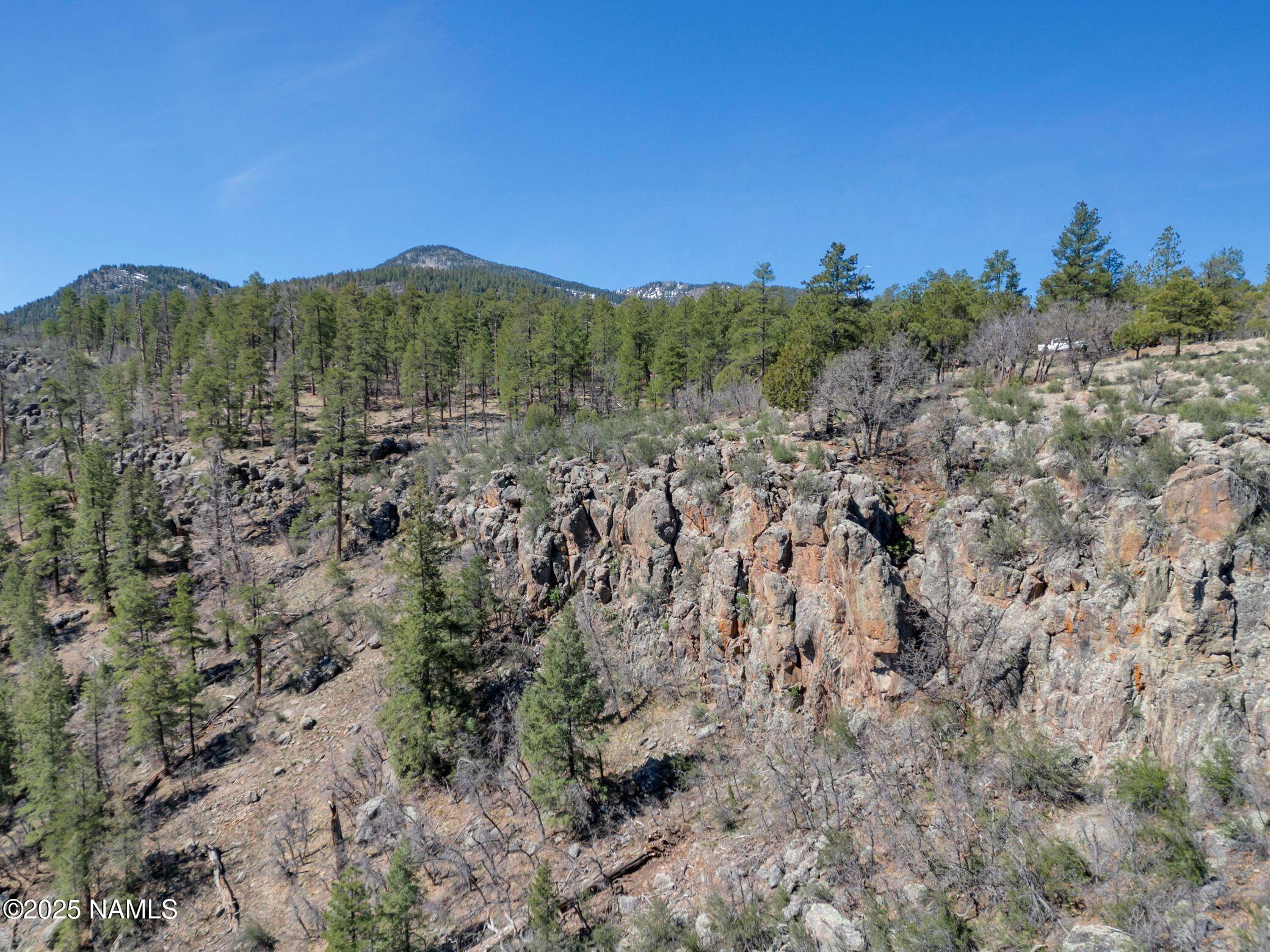1642 Canyon View Loop Williams, AZ 86046 - Photo 4 of 41 a view of a mountain in the distance in a field