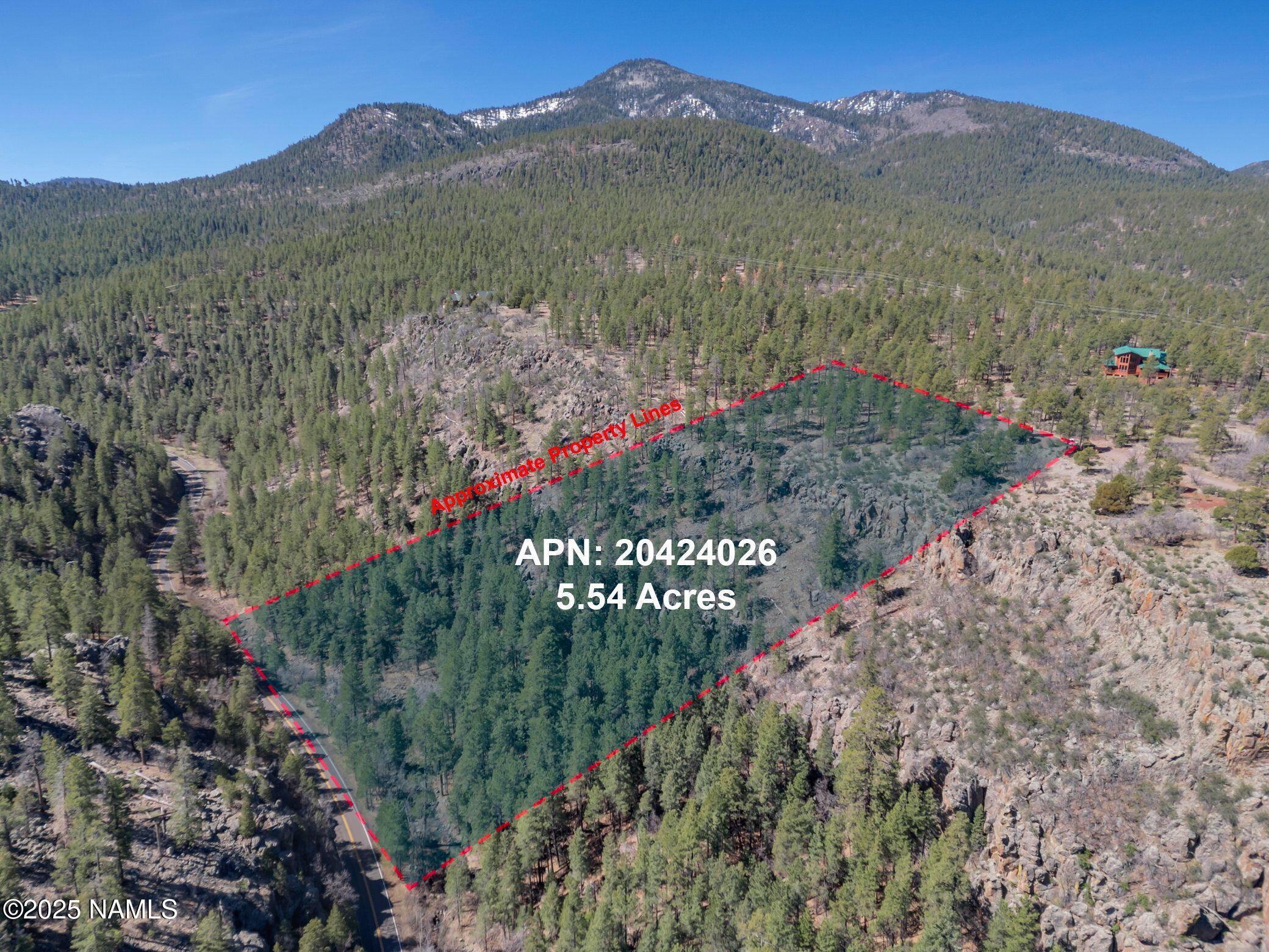1642 Canyon View Loop Williams, AZ 86046 - Photo 5 of 41 a view of a lush green hillside and a building