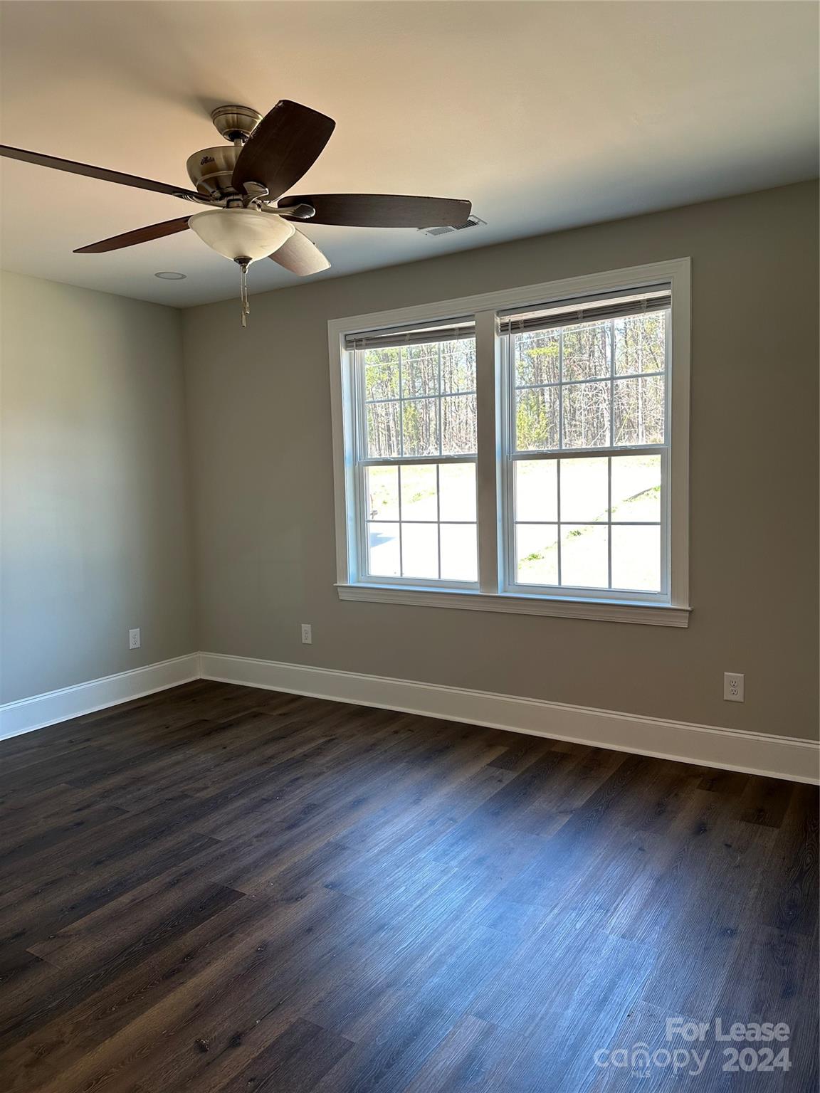 5507 Bucks Garage Road, Unit A Maiden, NC 28650 - Photo 12 of 17 a view of an empty room with wooden floor and a window