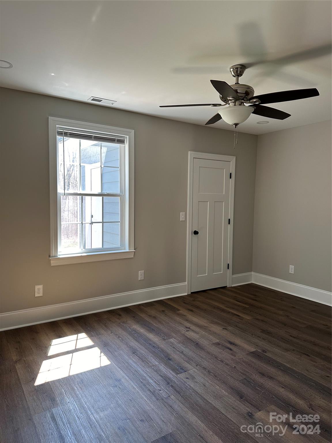 5507 Bucks Garage Road, Unit A Maiden, NC 28650 - Photo 14 of 17 wooden floor in an empty room with a window