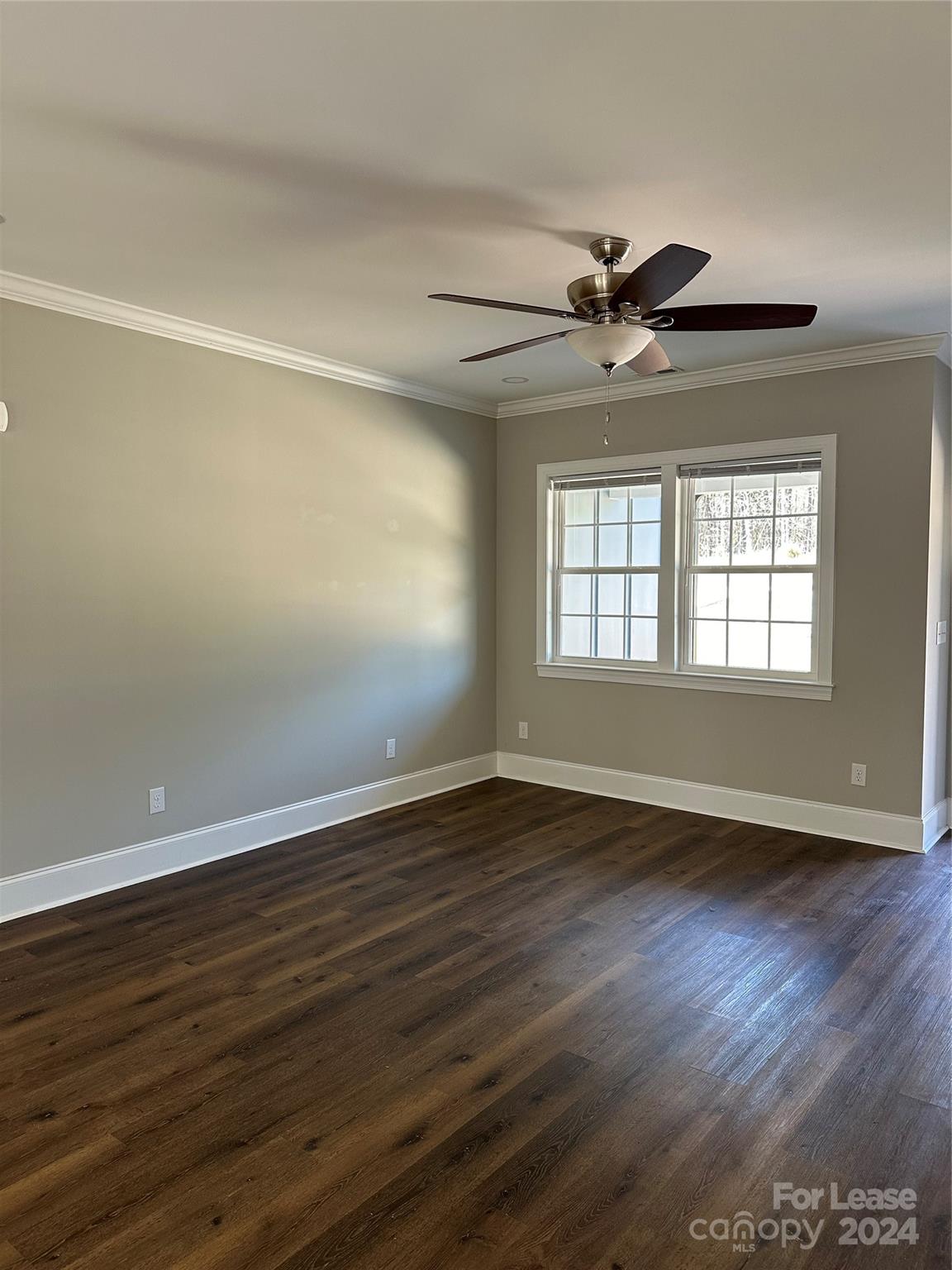 5507 Bucks Garage Road, Unit A Maiden, NC 28650 - Photo 4 of 17 a view of an empty room with wooden floor and a window