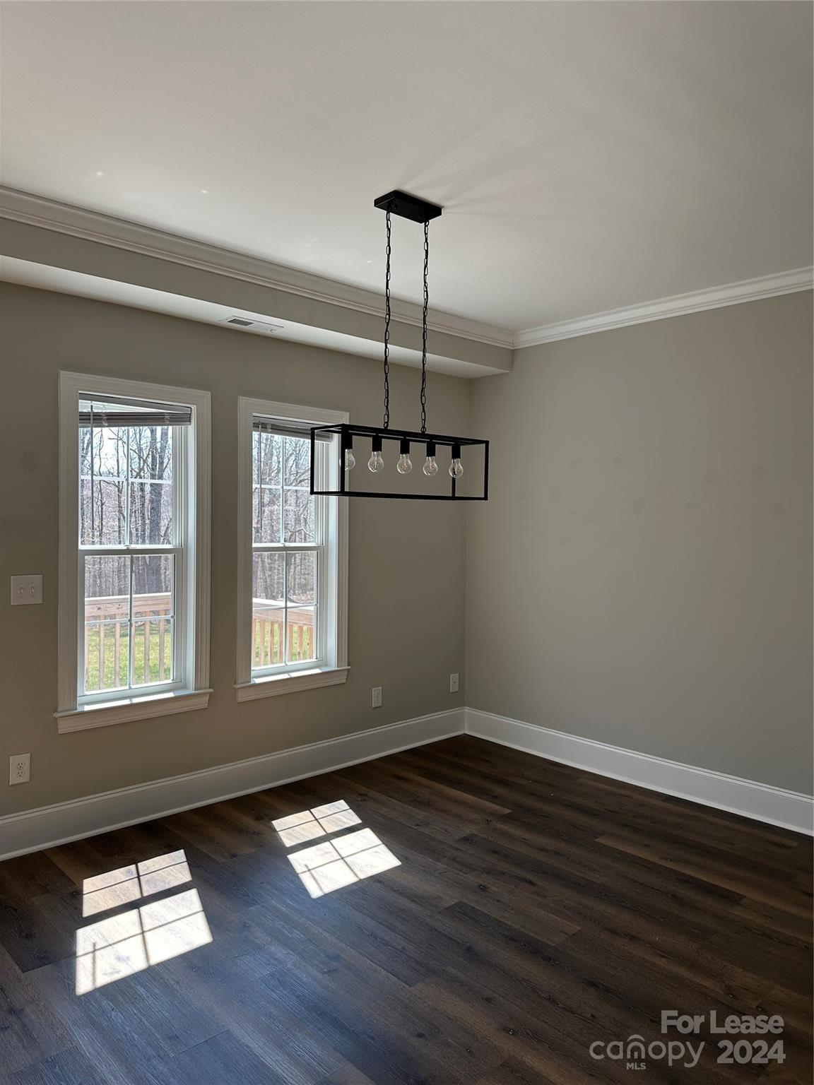 5507 Bucks Garage Road, Unit A Maiden, NC 28650 - Photo 7 of 17 a view of an empty room with wooden floor and a window