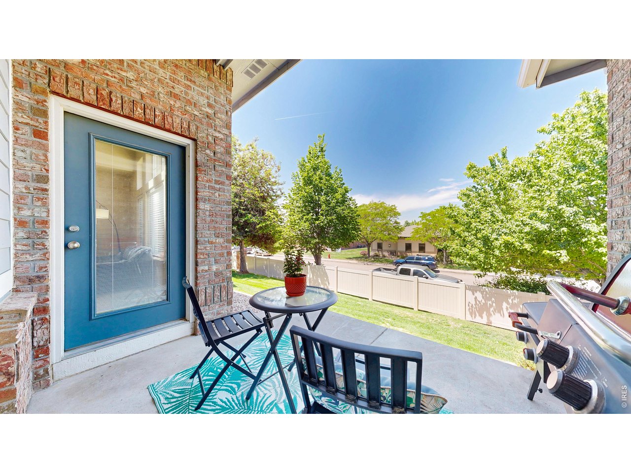4672 West 20th Road, Unit 413 Greeley, CO 80634 - Photo 31 of 37 a balcony with table and chairs