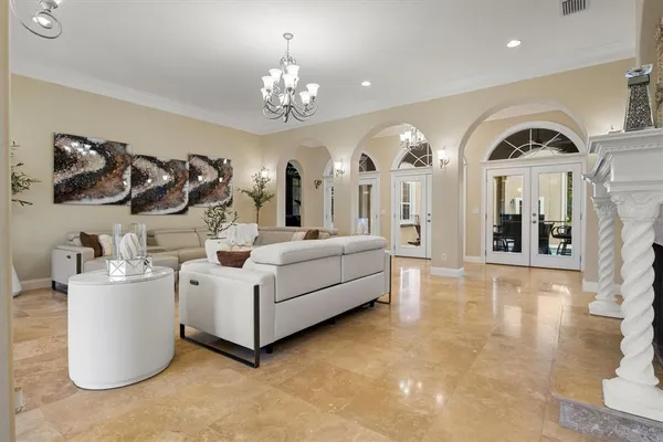 a kitchen with stainless steel appliances granite countertop a refrigerator a sink a stove a microwave and island