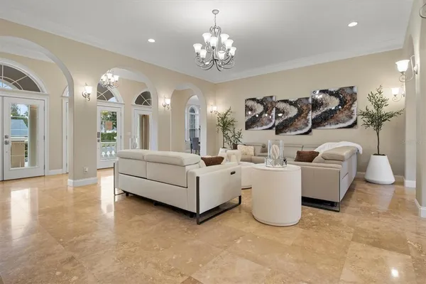 a kitchen with stainless steel appliances granite countertop a refrigerator a stove and white cabinets