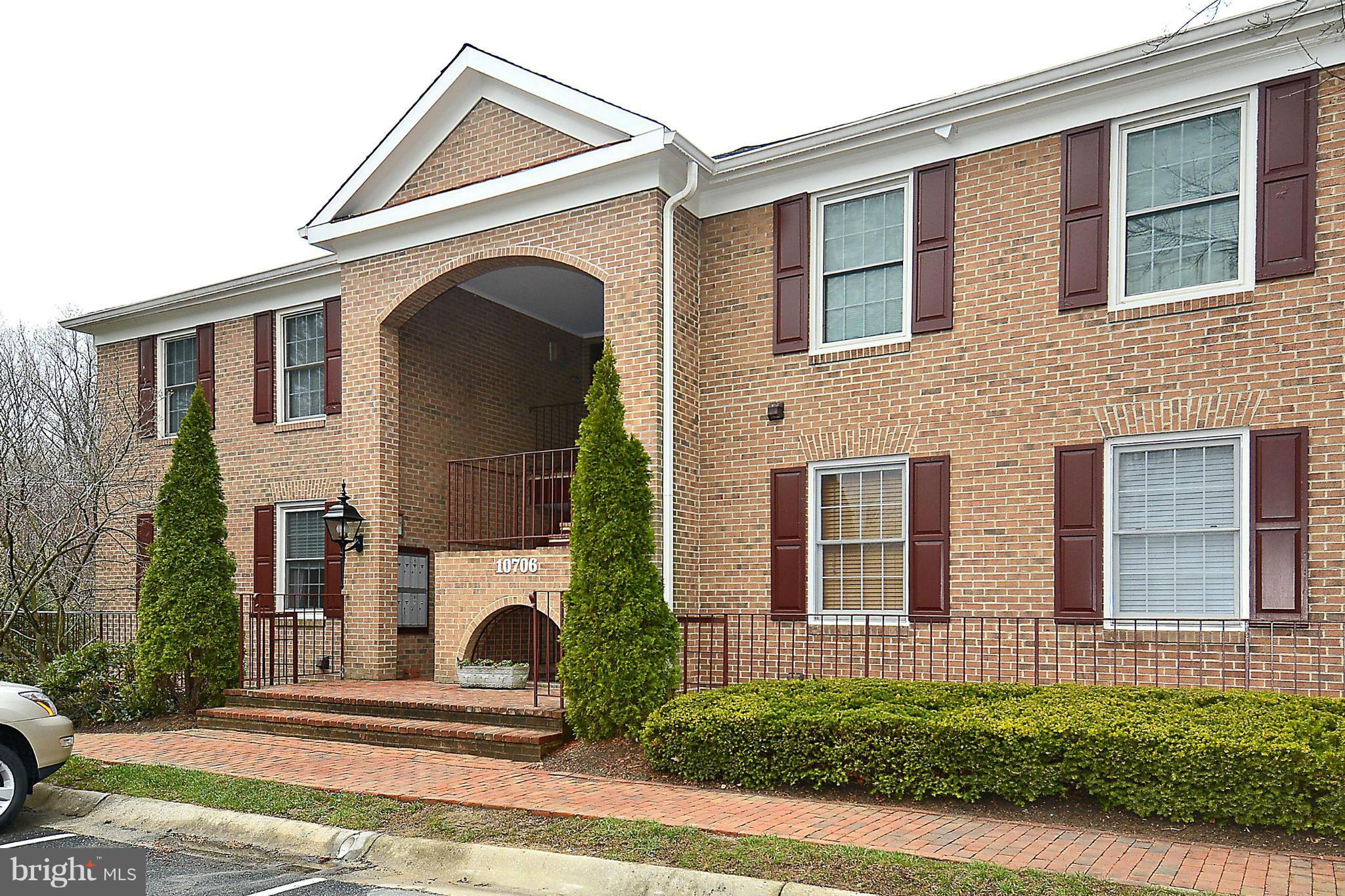 10706 Kings Riding Way, Unit T218 Rockville, MD 20852 - Photo 1 of 17 a view of a house with a small yard and plants