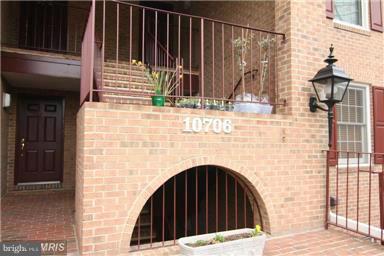 10706 Kings Riding Way, Unit T218 Rockville, MD 20852 - Photo 2 of 17 a view of wooden door and brick wall