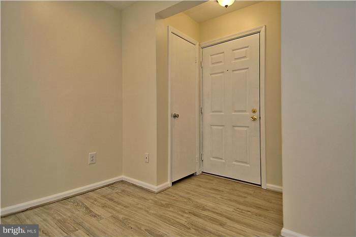 10706 Kings Riding Way, Unit T218 Rockville, MD 20852 - Photo 3 of 17 a view of an empty room with wooden floor