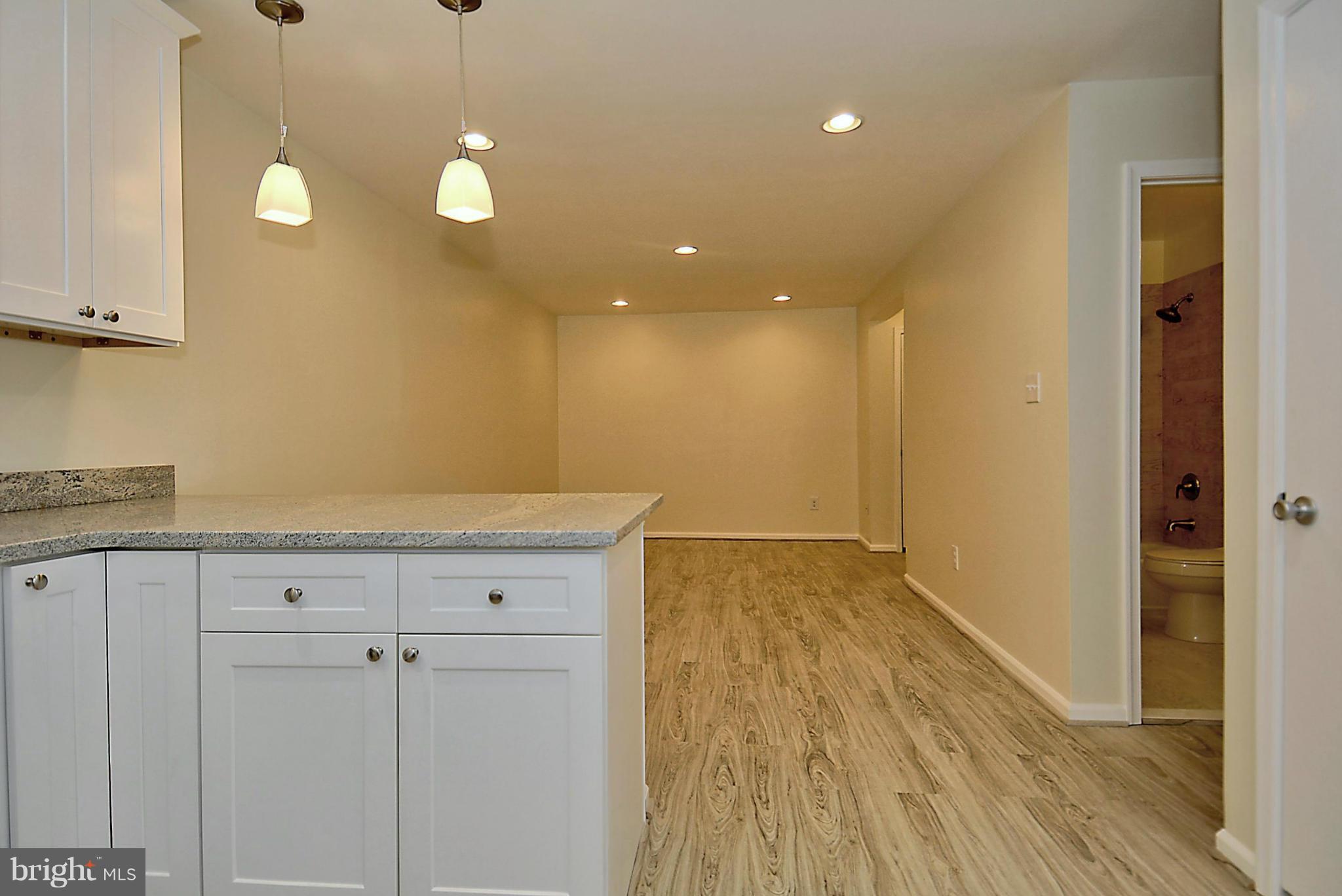 10706 Kings Riding Way, Unit T218 Rockville, MD 20852 - Photo 10 of 17 a view of kitchen with wooden floor