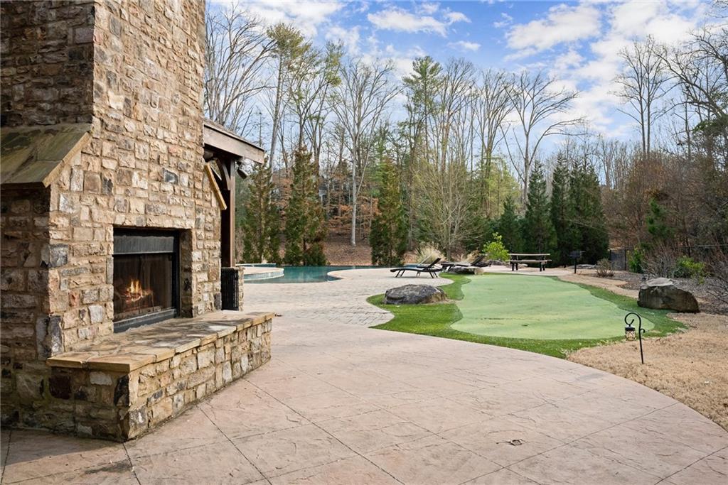 1223 Bloomsbury Lane Gainesville, GA 30501 - Photo 15 of 17 a view of a swimming pool with a yard and trees