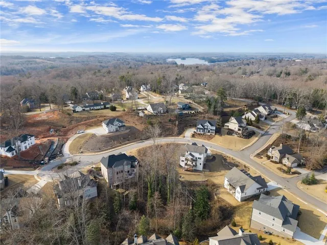 an aerial view of a residential houses with outdoor space