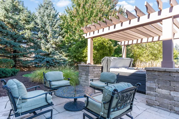a view of a patio with couches chairs and a fire pit