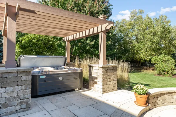a view of backyard with barbeque grill and outdoor seating