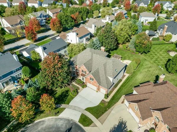 an aerial view of residential house with outdoor space and street view
